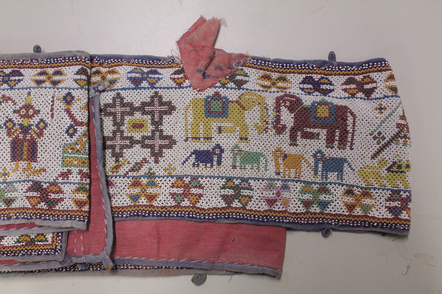 AN EARLY 20TH CENTURY WESTERN INDIAN GUJARAT LONG BEADWORK PANEL, with polychrome stylised geometric - Image 3 of 7
