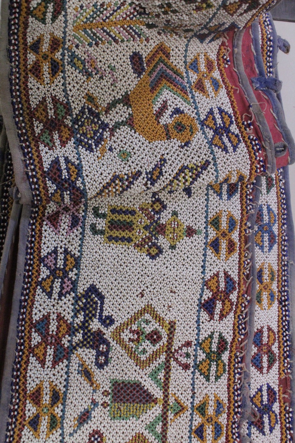 AN EARLY 20TH CENTURY WESTERN INDIAN GUJARAT LONG BEADWORK PANEL, with polychrome stylised geometric - Image 7 of 7