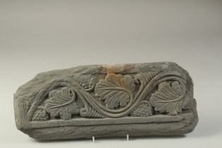 A FINE AND LARGE GANDHARA CARVED GREY SCHIST STONE PANEL, depicting grape vines, 43cm long.