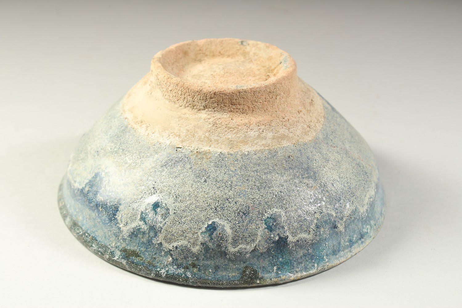 A 12TH CENTURY NISHAPUR GLAZED POTTERY BOWL, the interior with calligraphy, 19cm diameter. - Image 3 of 3