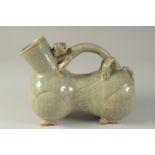 AN UNUSUAL CHINESE CELADON GLAZED POTTERY EWER / VESSEL, with zoomorphic handle, 21cm long.