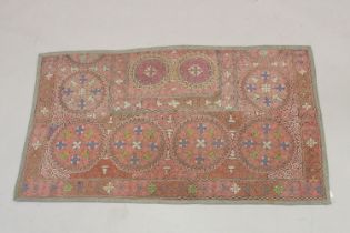 A FINE EARLY 20TH CENTURY CENTRAL ASIAN SUZANI EMBROIDERED TEXTILE, 160cm x 90cm.