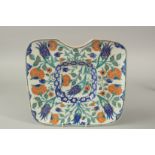 A TURKISH OTTOMAN IZNIK DESIGN BARBER'S WASH TRAY, 31cm x 28.5cm.