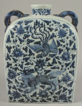 A VERY LARGE CHINESE BLUE AND WHITE PORCELAIN WATER FLASK, with double-twin handles and painted with