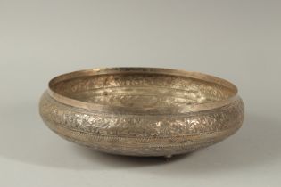 A LARGE 19TH CENTURY EMOSSEDED AND CHASED SILVER BOWL, with a band of scrolling foliate decoration