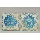 TWO EARLY 17TH CENTURY OTTOMAN IZNIK TILES, depicting a large lotus flower, (2).