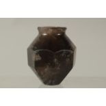 AN ISLAMIC CARVED ROCK CRYSTAL BOTTLE, 6cm high.