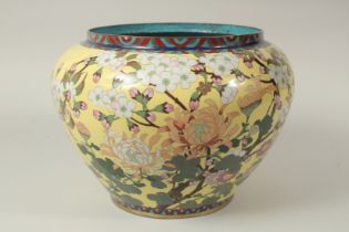 A LARGE CHINESE YELLOW GROUND CLOISONNE JARDINIERE, with floral decoration, the interior and base