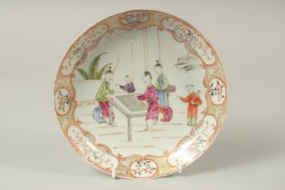 AN 18TH CENTURY CHINESE PORCELAIN DISH, painted with figures and heightened with gilt highlights,