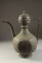 A LARGE 18TH CENTURY INDIAN BRASS EWER, 37cm high.