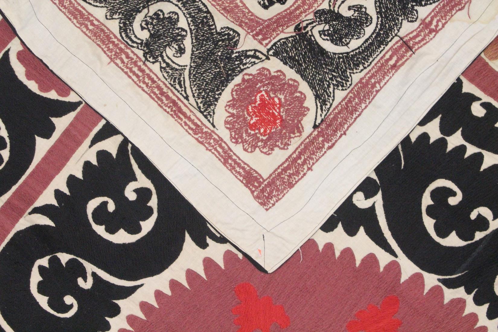 AN UZBEK SUZANI EMBROIDERED TEXTILE, with maroon, red, and black motif on cream ground, 158cm x - Image 3 of 3