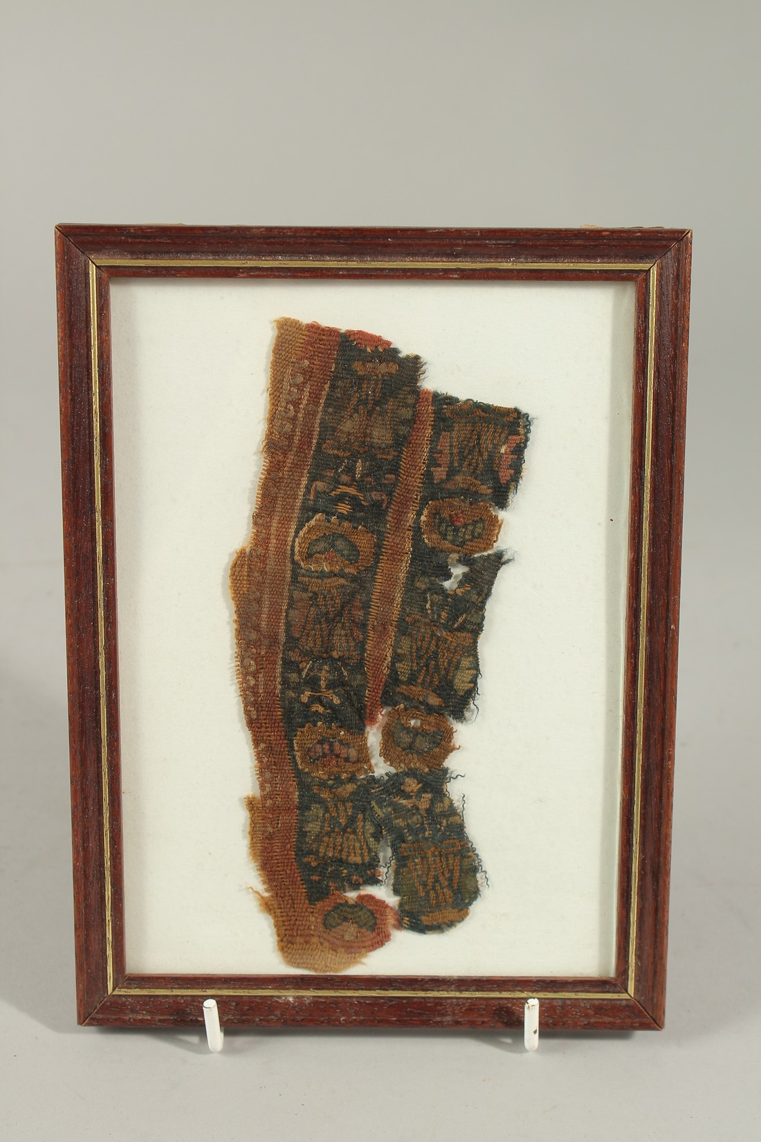 A 6TH CENTURY AD COPTIC EGYPT TEXTILE FRAGMENT, framed and glazed.