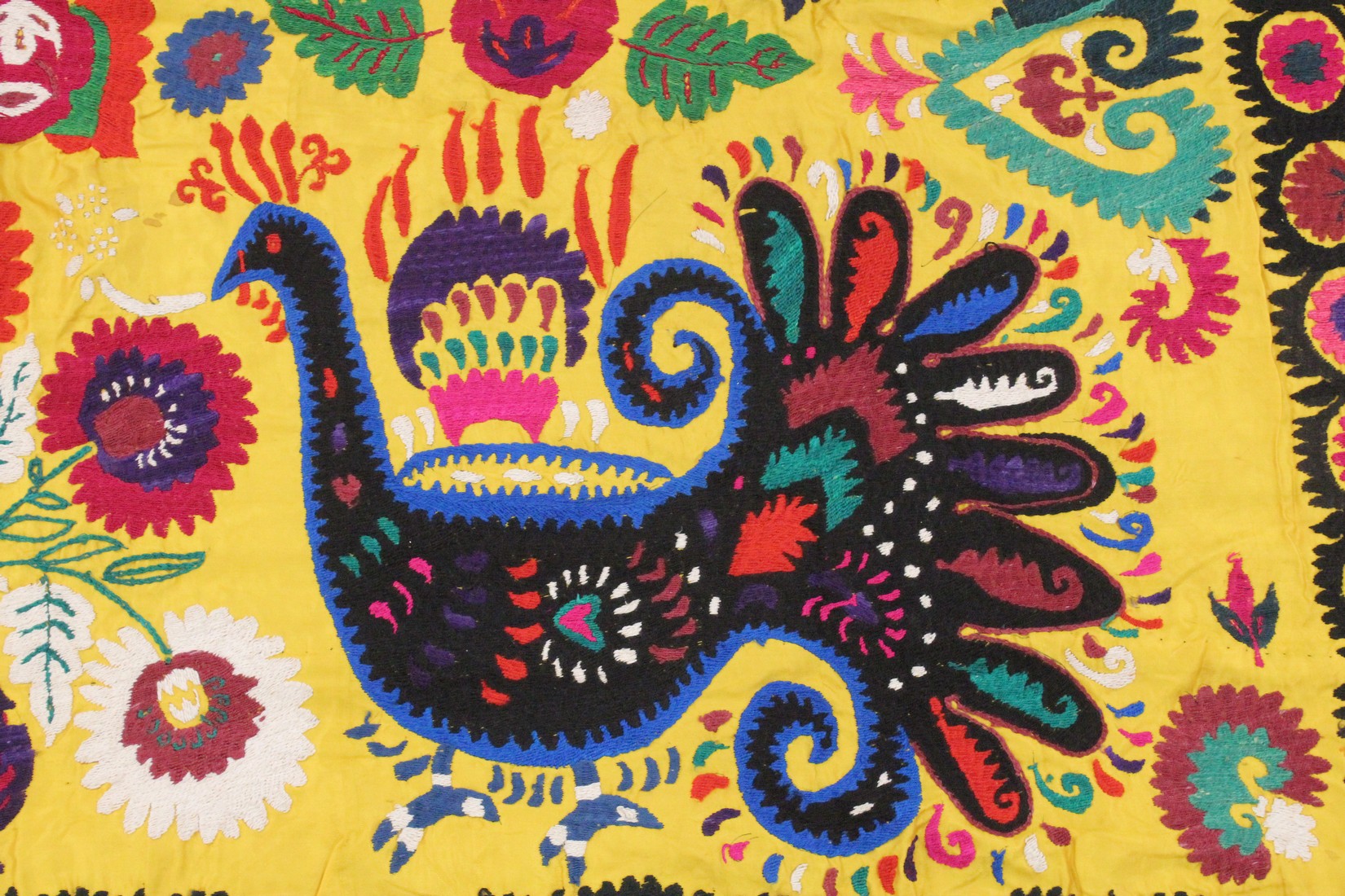 AN UZBEK SUZANI EMBROIDERED TEXTILE, with vibrant polychrome decoration of peacocks and blossoming - Image 3 of 5