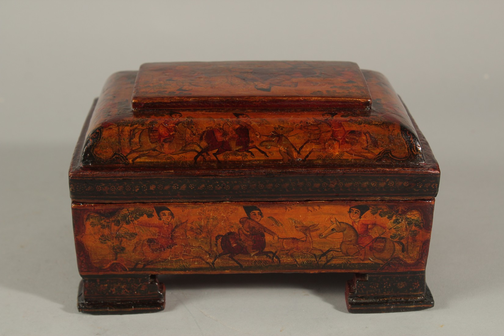 A FINE 19TH CENTURY PERSIAN QAJAR PAINTED AND LACQUERED PAPER MACHE BOX, raised on four feet, 18cm x - Image 3 of 6