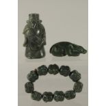A COLLECTION OF THREE CARVED GREEN HARDSTONE PIECES, (3).
