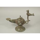 A LARGE 12TH-13TH CENTURY SELJUK OPENWORKED BRONZE OIL LAMP, with bird finial, 38cm long, 31cm