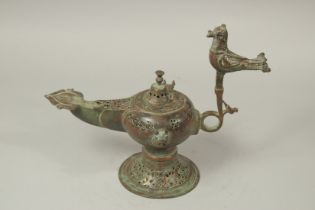 A LARGE 12TH-13TH CENTURY SELJUK OPENWORKED BRONZE OIL LAMP, with bird finial, 38cm long, 31cm