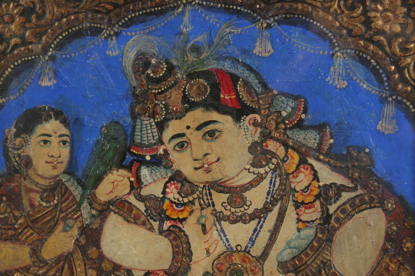 A FINE 19TH CENTURY SOUTH INDIAN TANJORE PAINTING OF ENTHRONED BABY KRISHNA, 39cm x 34cm overall. - Image 2 of 3