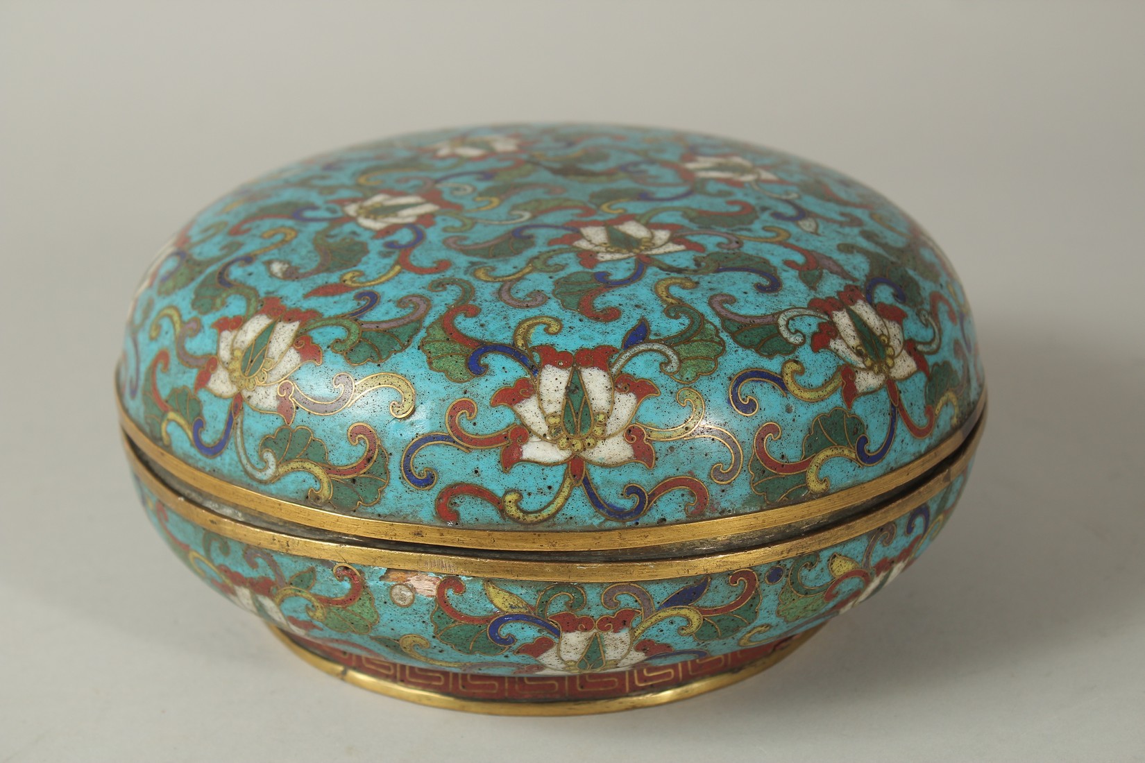 A 19TH CENTURY CHINESE BLUE GROUND CLOISONNE CIRCULAR LIDDED BOX, with floral motif decoration, 20. - Image 2 of 6