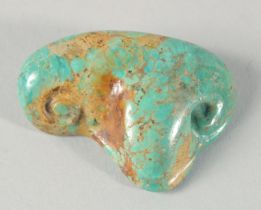 AN EGYPTIAN CARVED TURQUOISE STONE EYE, 5cm wide.
