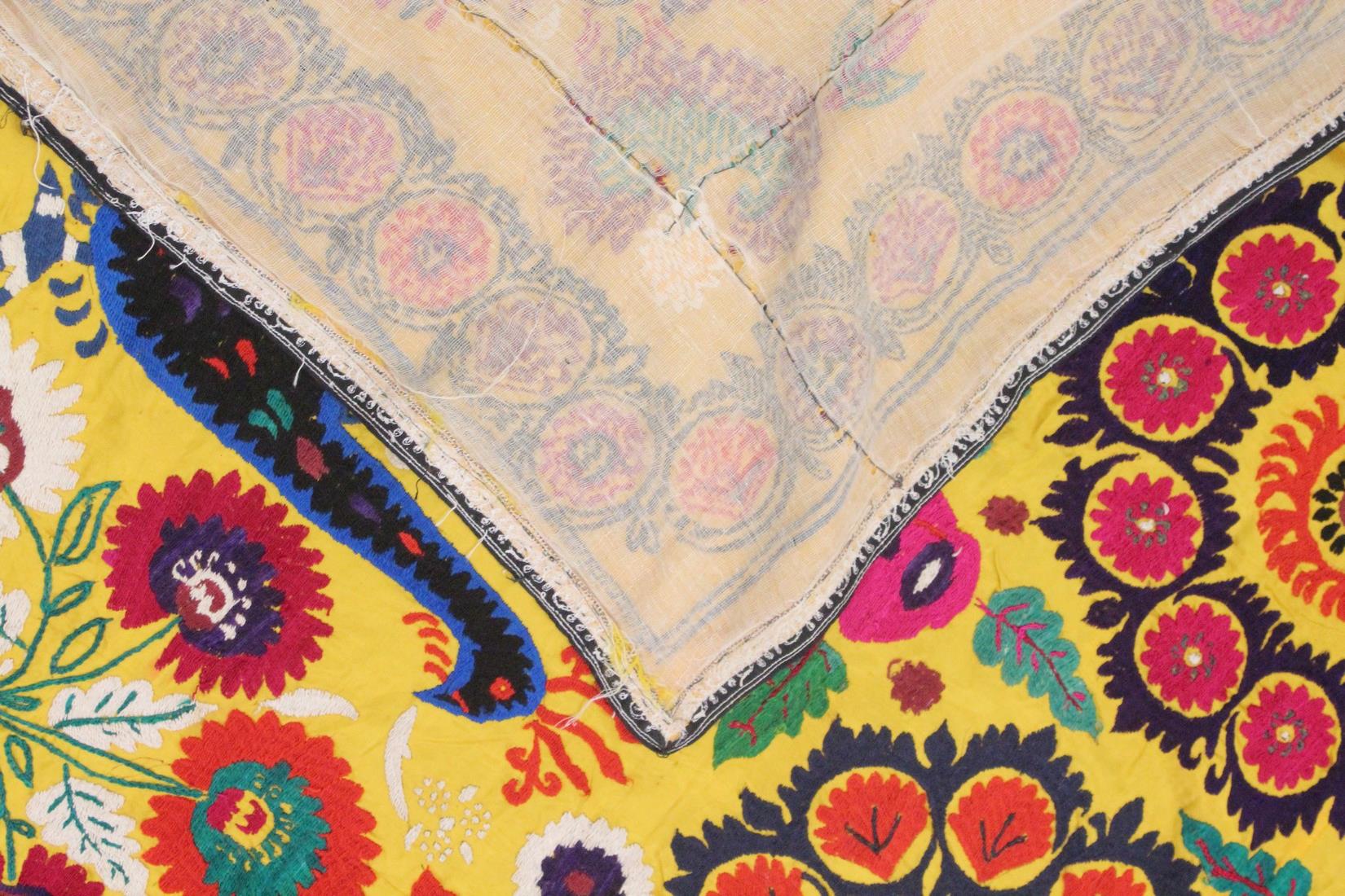 AN UZBEK SUZANI EMBROIDERED TEXTILE, with vibrant polychrome decoration of peacocks and blossoming - Image 5 of 5