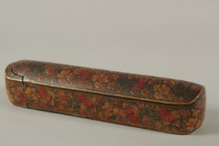 A FINE AND LARGE 19TH CENTURY INDIAN KASHMIRI LACQUERED PAPIER MACHE PEN BOX, 31cm long.