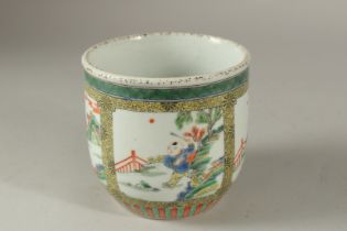 A CHINESE FAMILLE VERTE PORCELAIN PLANTER, painted with panels of boys in garden settings, 11.5cm