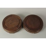 A VERY LARGE PAIR OF CHINESE CARVED HARDWOOD CIRCULAR STANDS, with a band of carved wave pattern