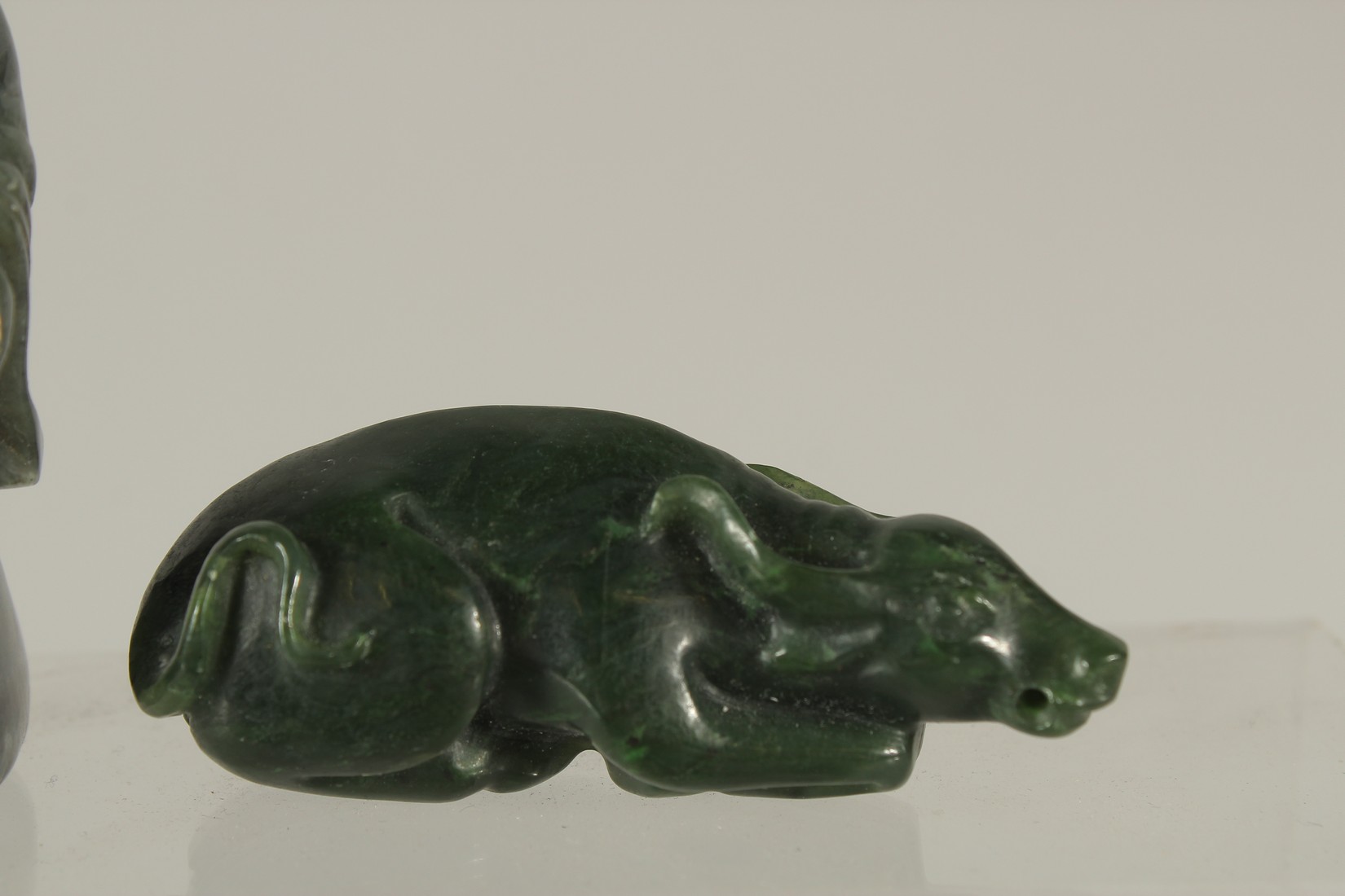 A COLLECTION OF THREE CARVED GREEN HARDSTONE PIECES, (3). - Image 3 of 4