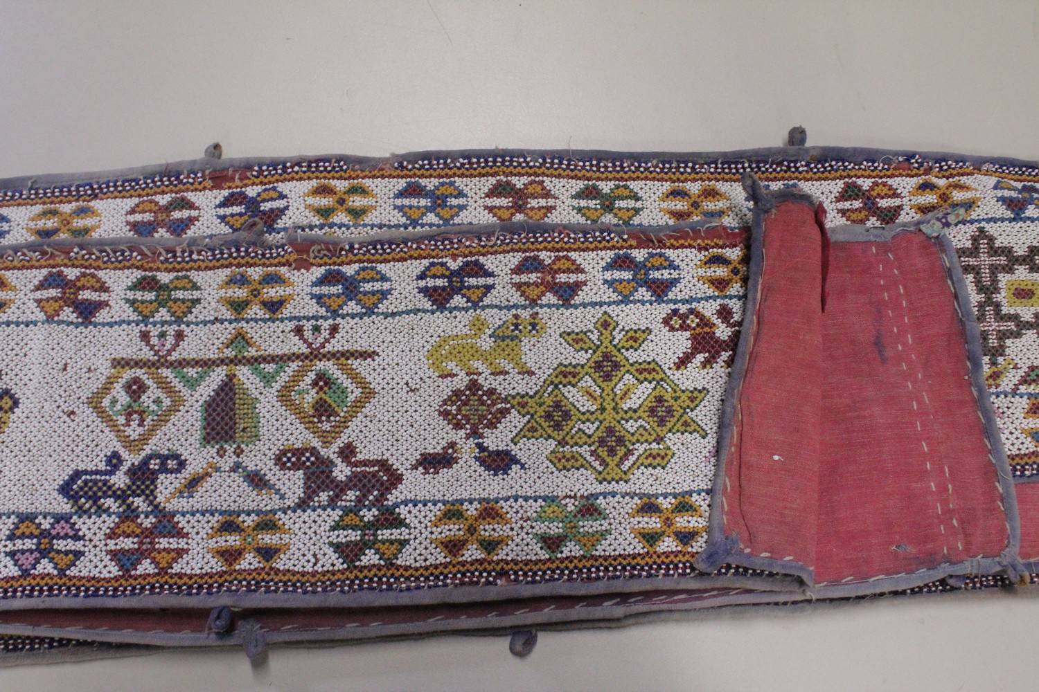 AN EARLY 20TH CENTURY WESTERN INDIAN GUJARAT LONG BEADWORK PANEL, with polychrome stylised geometric - Image 6 of 7