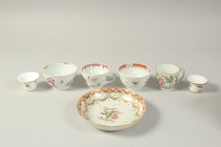 A COLLECTION OF CHINESE PORCELAIN ITEMS, comprising two tea bowls, two tea cups, two small candle