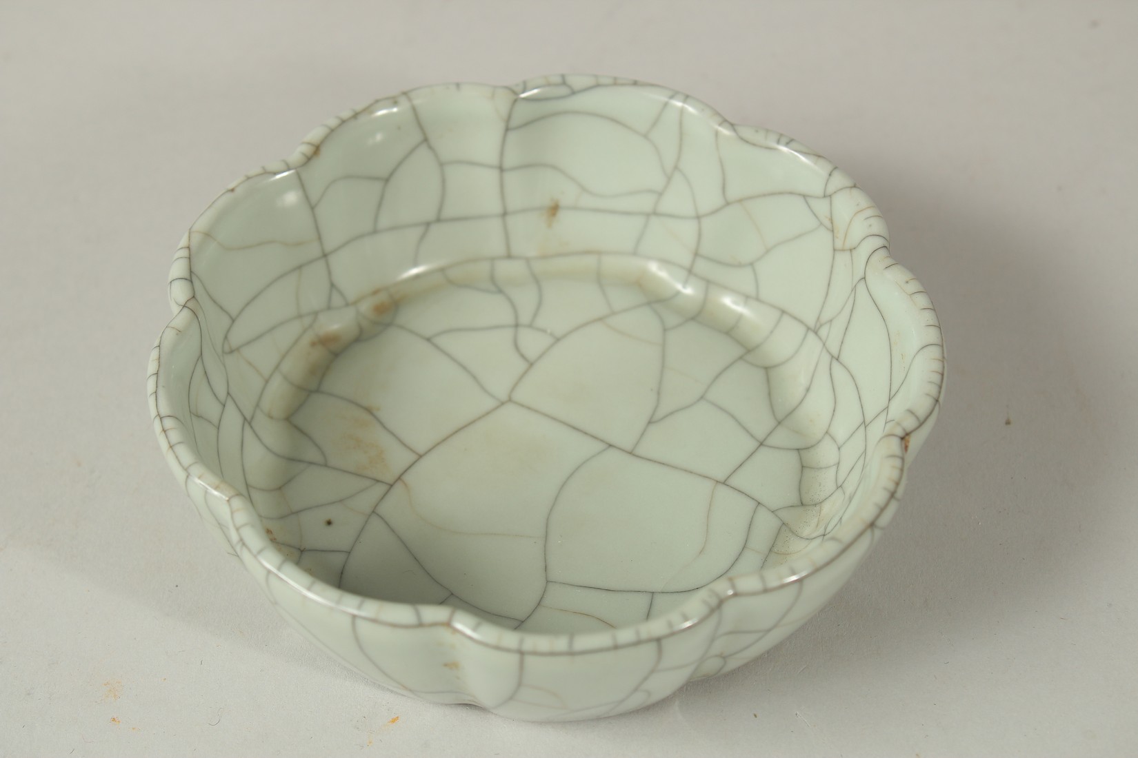 A CHINESE CELADON CRACKLE GLAZE PETAL-RIM BOWL / BRUSH WASHER, the base with character mark and