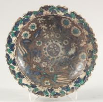 A RARE LARGE EARLY IZNIK STYLE DAMASCUS POTTERY DISH, possibly 16th/17th century, painted with