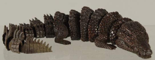 AN ARTICULATEDF BRONZE OKIMONO OF A CROCODILE, 20cm long.