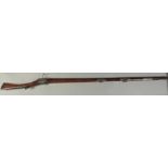 A 17TH CENTURY TURKISH OTTOMAN MATCHLOCK CASTLE RIFLE, with heavy ribbed barrel and silver bands and