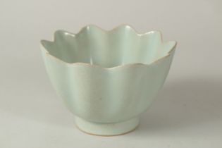 A TALL CHINESE CELADON GLAZED PETAL-FORM BOWL, 16cm diameter.