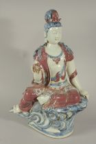 A LARGE CHINESE UNDERGLAZE RED AND BLUE PORCELAIN GUANYIN, 51cm high.