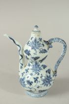 A CHINESE BLUE AND WHITE PORCELAIN LIDDED WINE POT, with dragon-formed handle, the body painted with