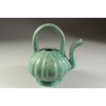 AN UNUSUAL 19TH CENTURY OR EARLIER INDIAN TURQUOISE GLAZED POTTERY EWER, 20cm high.