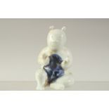 A SMALL CHINESE BLUE AND WHITE GLAZE POTTERY FIGURE, 8.5cm high.