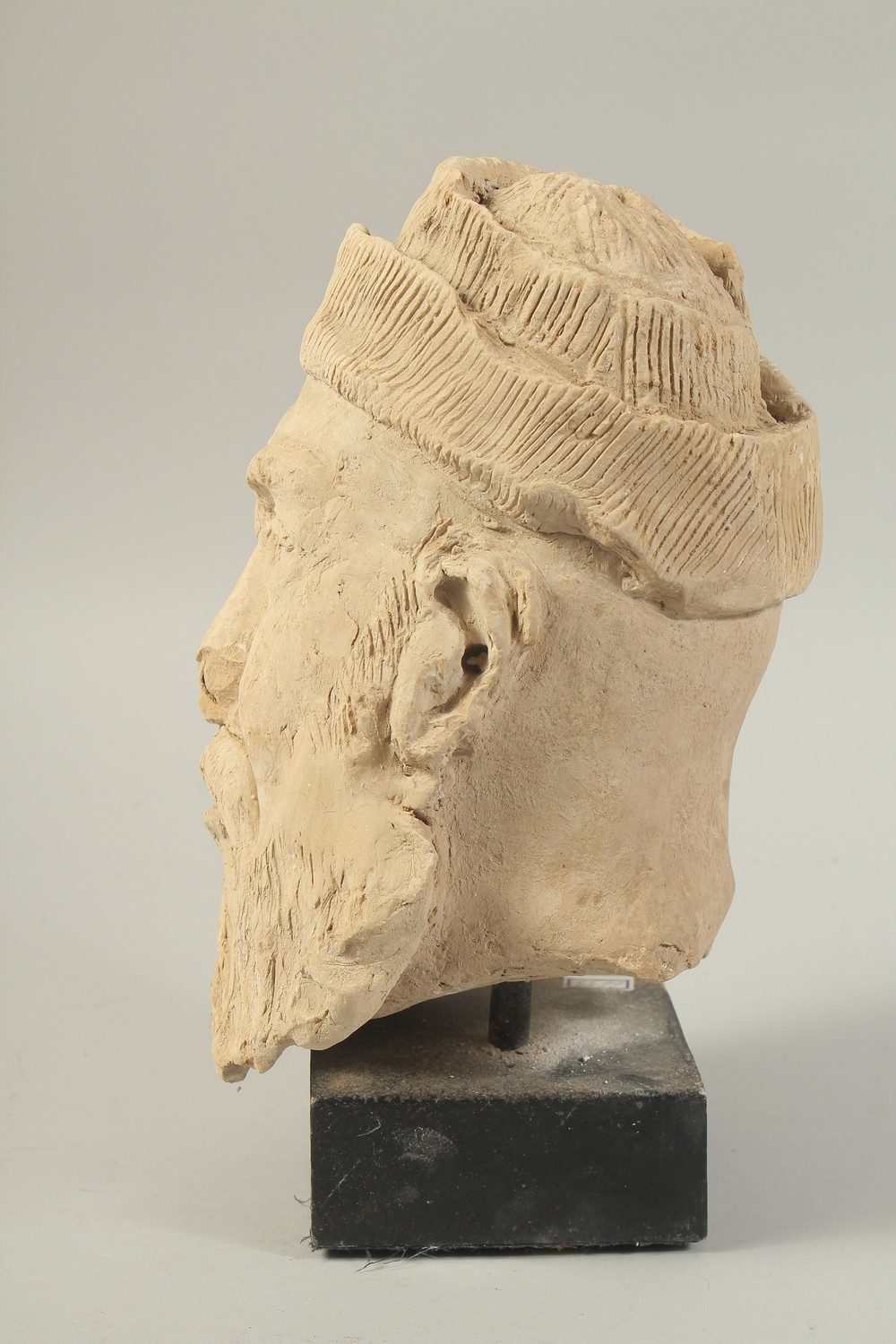 A CARVED CLAY HEAD SCULPTURE, raised on stand. - Image 2 of 4