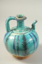 A PERSIAN KASHAN TURQUOISE GLAZED POTTERY EWER, 20cm high.