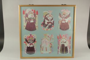 AN UNUSUAL CHINESE LAID PAPER PICTURE DEPICTING SIX MASKS, framed and glazed, 70.5cm x 71.5cm.