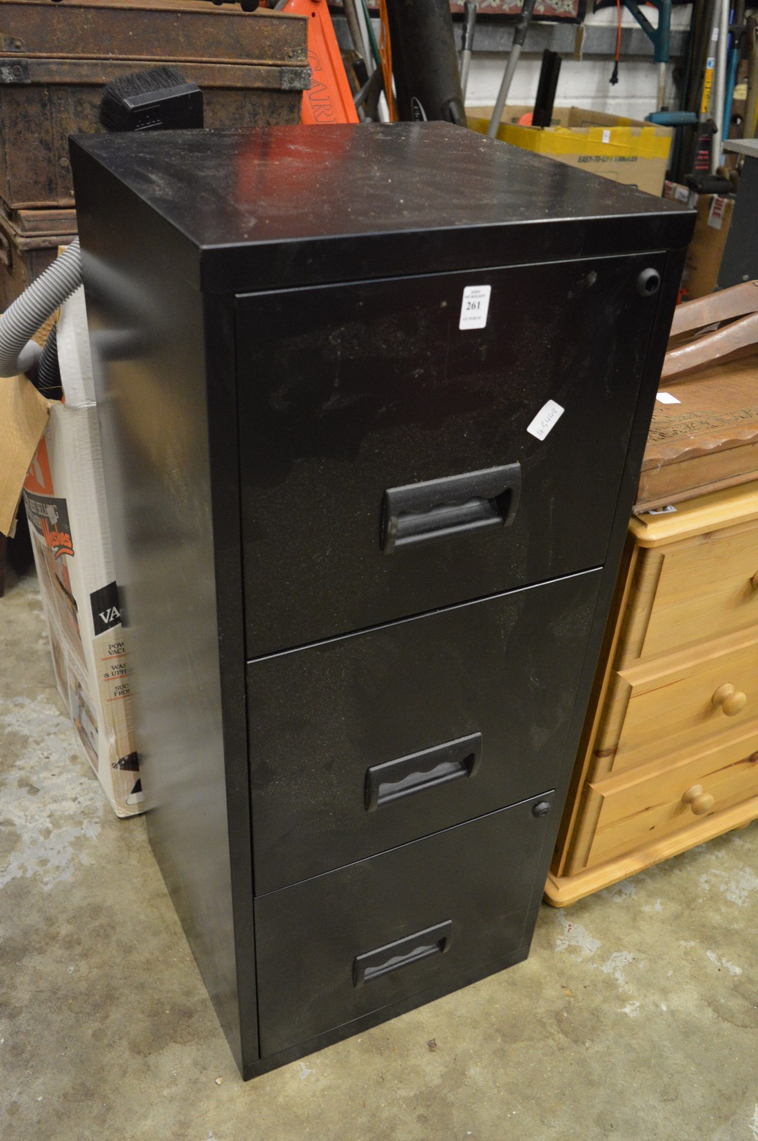 Metal filing cabinet.