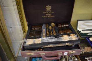 Cased set of bronzed cutlery.