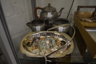 A plated basket, bijouterie and a pewter three piece tea service.