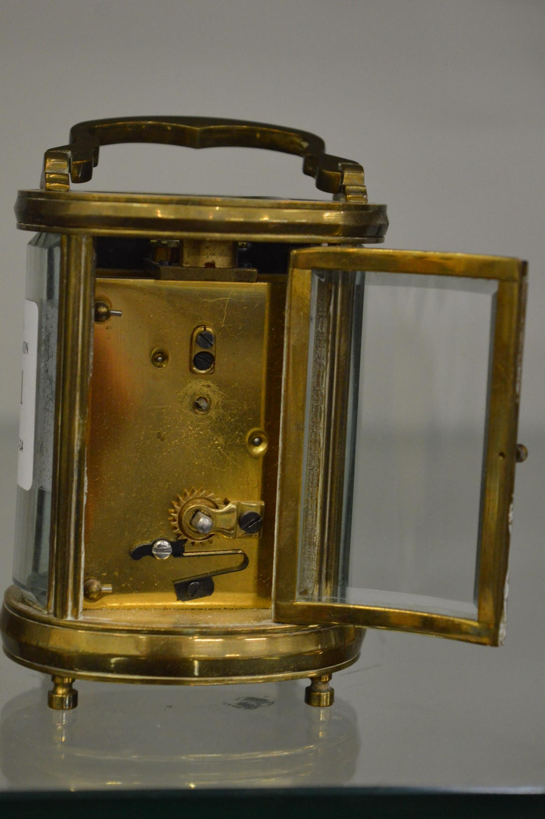A small oval cased brass carriage clock. - Image 2 of 3