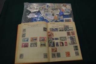 Stamp album and contents and numerous loose stamps.