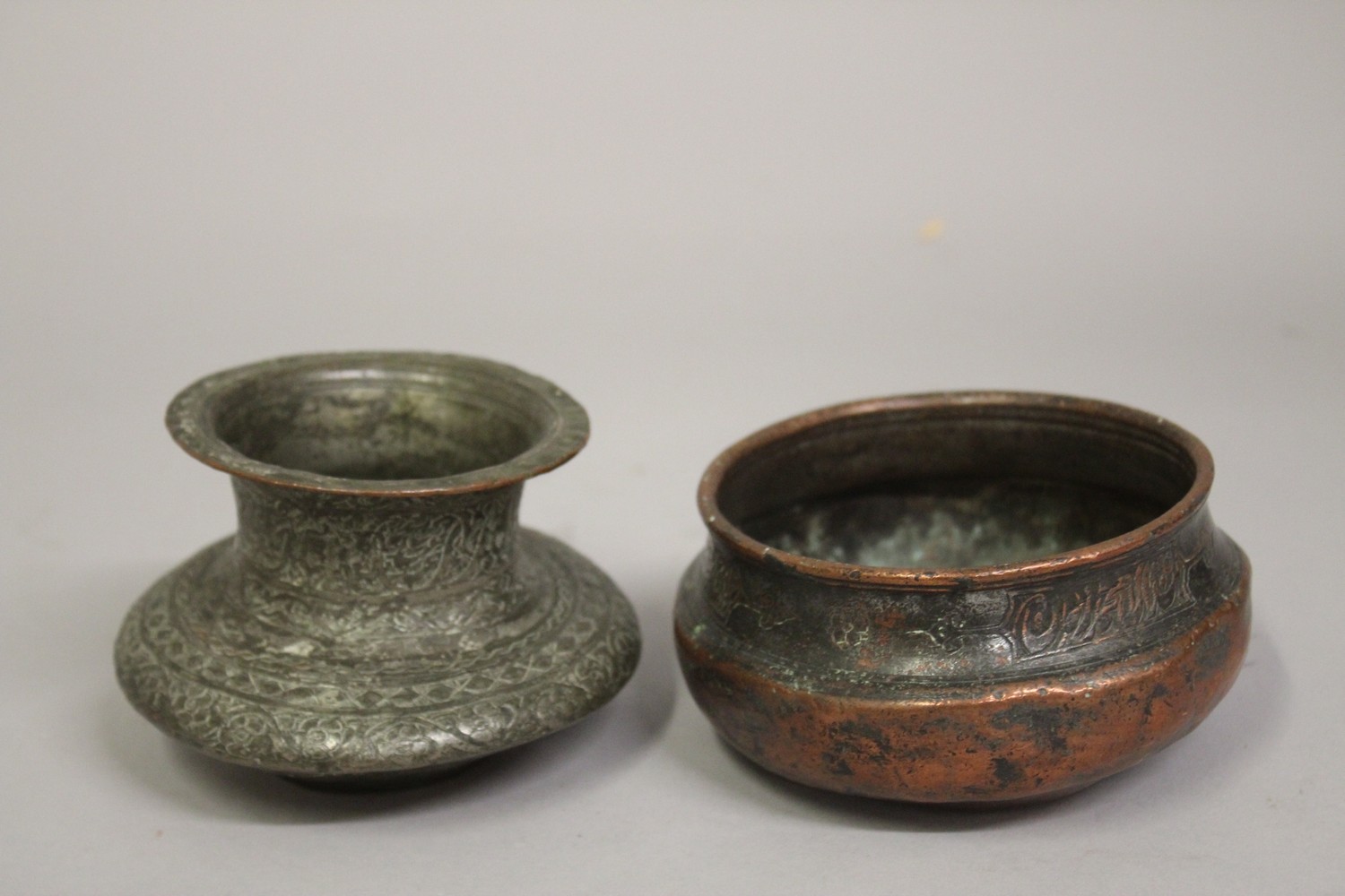 TWO SMALL PERSIAN 17TH CENTURY SAFAVID COPPER BOWLS, (2).