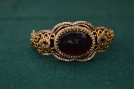 Decorative silver, gilt metal and gem set bangle.